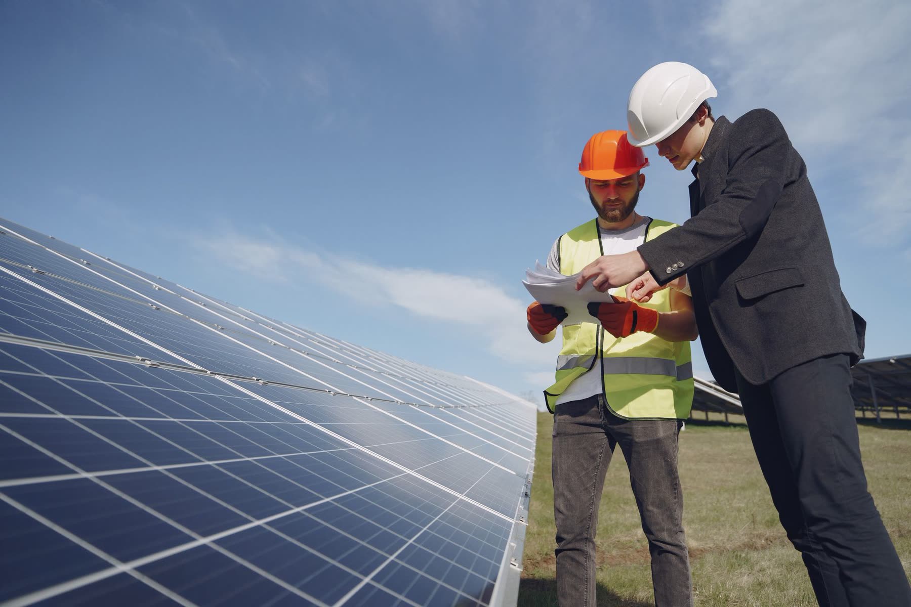 Technician reviewing inspection data at a solar site
